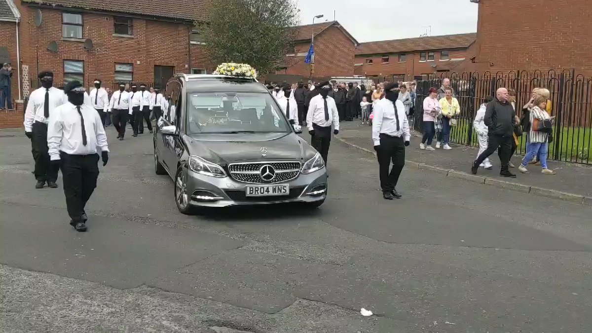 Masked men parade openly in West Belfast beside funeral cortege of former INLA prisoner Martin McElkerney. PSNI filming events as hundreds line streets. @BelTel   