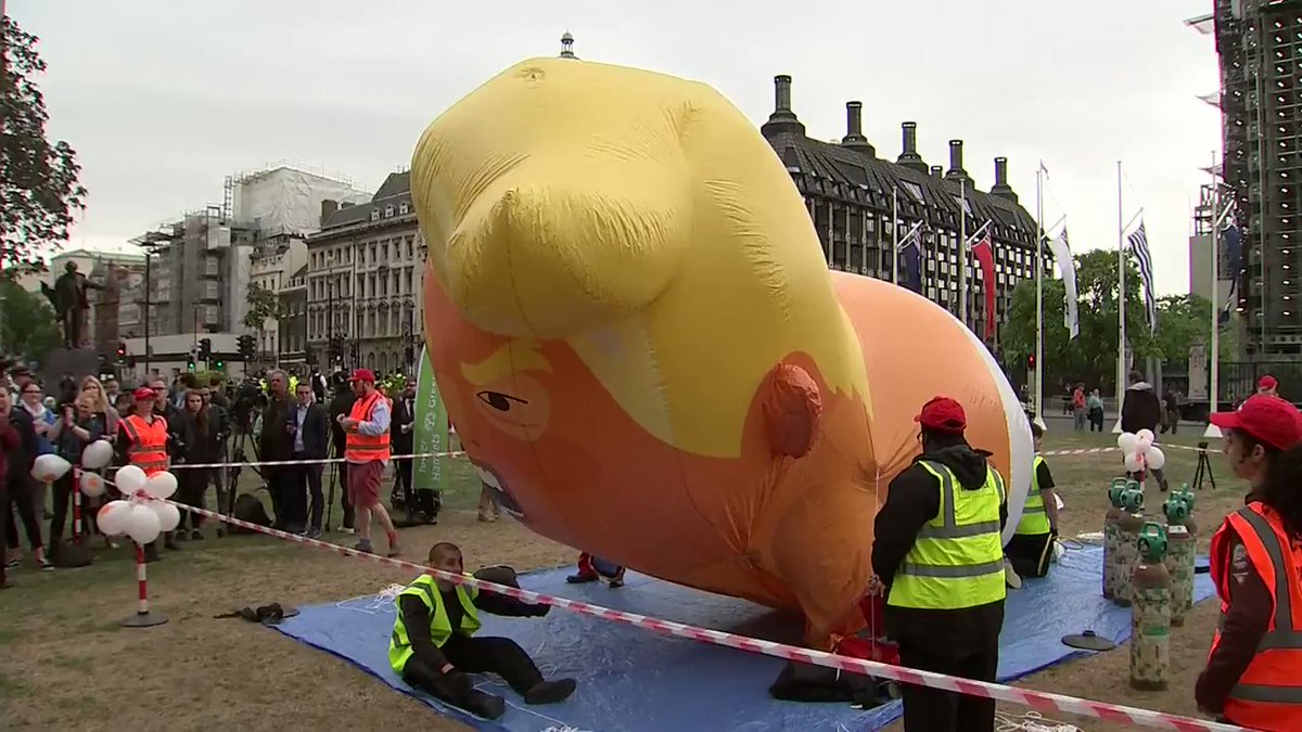 A giant Trump baby balloon is being inflated at London's Parliament Square as protesters gather for a demonstration against #TrumpUKVisit   
