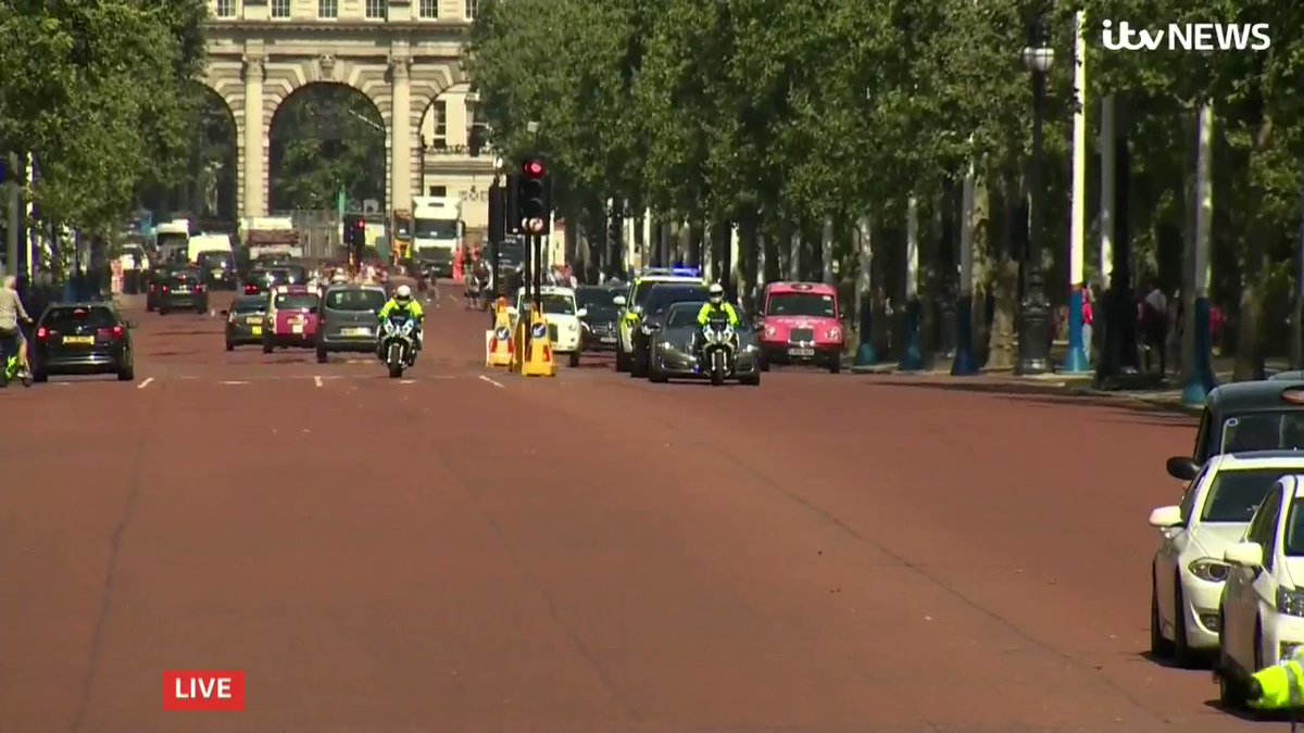 Greenpeace protesters blocked the route of Boris Johnson as he was driven to Buckingham Palace to meet the Queen