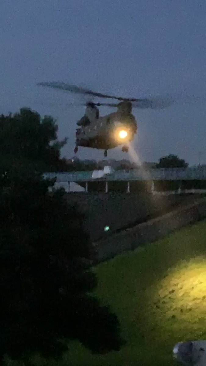 RAF helicopter helping efforts to repair the damaged reservoir above Whaley Bridge