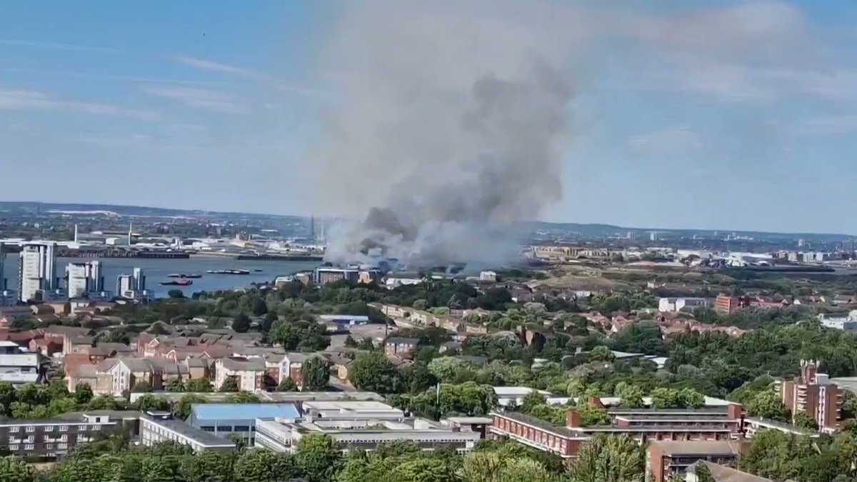 Eight fire engines, the fire boat and around 65 firefighters are dealing with a grass fire on Defence Close in Thamesmead.