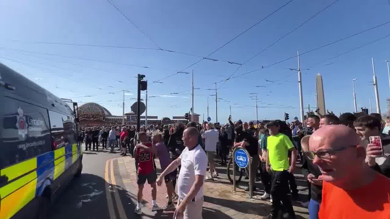 Football chants from Tommy Robinson supporters in Blackpool rally. Crowd members calling male police officers being called “nonces” and slurring female ones as infertile “d*** b****es”