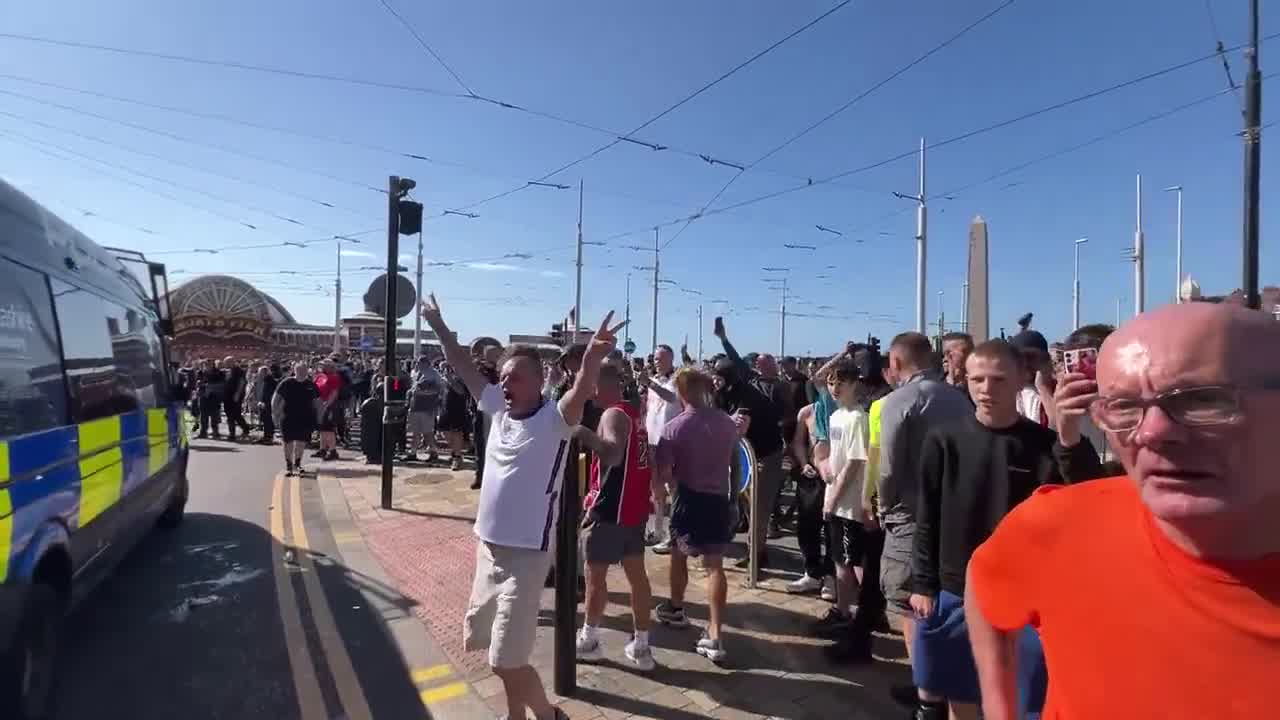 Football chants from Tommy Robinson supporters in Blackpool rally. Crowd members calling male police officers being called “nonces” and slurring female ones as infertile “d*** b****es”