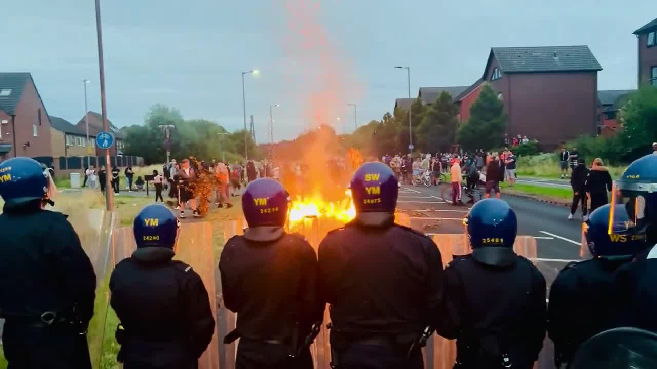 Rioters are stoking up another bonfire on the main road to the Rotherham migrant hotel.  It's Manvers Way, the A633, and it's flanked by homes on both sides